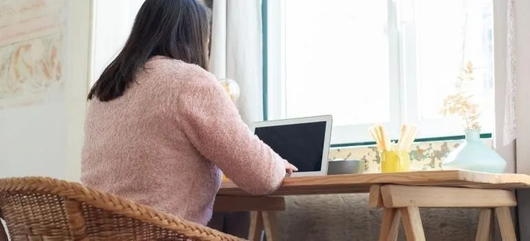 a woman working after designing a home office in a brand new space